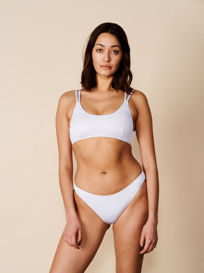 Female wearing our Adrianna Bikini Briefs in white. Seen from the front.