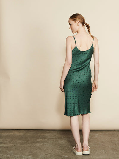 Female wearing our Fie Slip Dress Forest. Seen from the back.